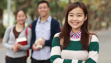 picture of college students looking at camera smile