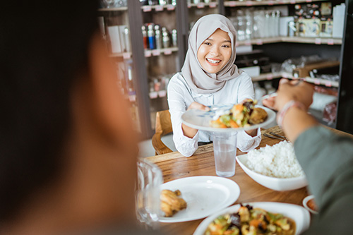 Muslim Student Eating a Meal